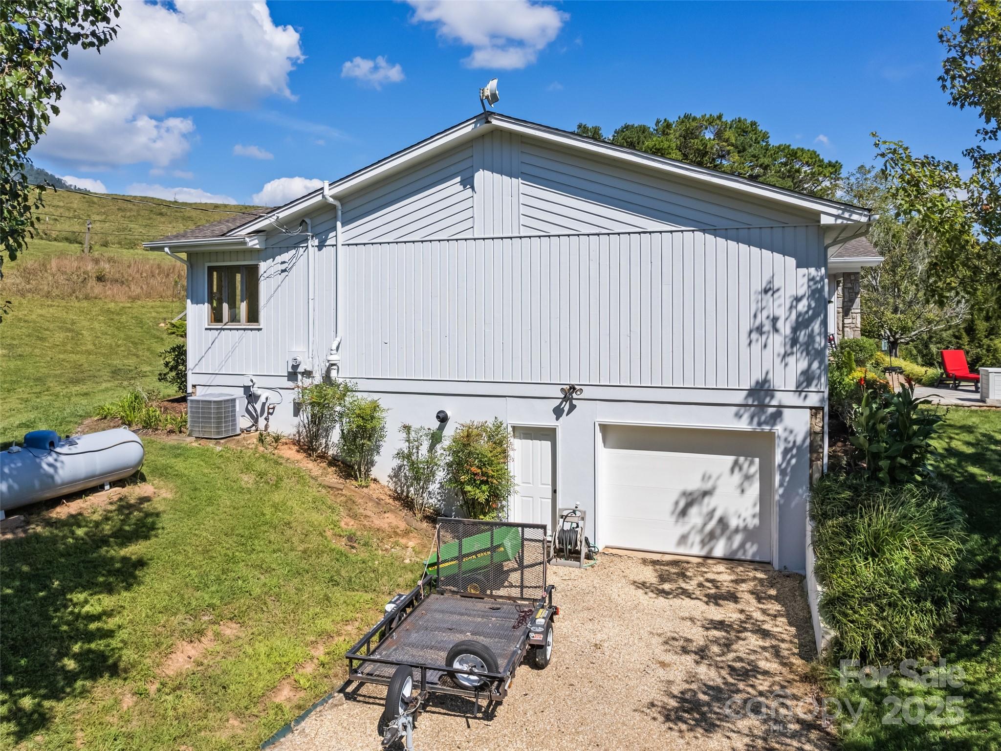 3735 Iron Duff Road Waynesville, NC 28785 - Photo 5 of 48 a front view of a house with garden