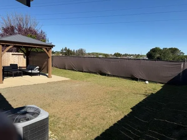 a view of a swimming pool with a table under an umbrella