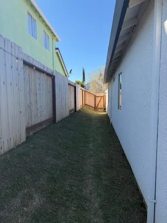 a view of backyard and deck