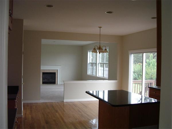 367 Raymond Road Plymouth, MA 02360 - Photo 12 of 12 a dining room with wooden floor a chandelier a glass table and windows