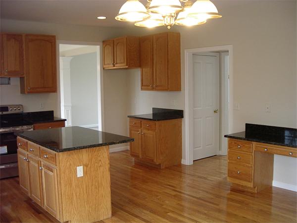 367 Raymond Road Plymouth, MA 02360 - Photo 4 of 12 a kitchen with granite countertop a sink a counter space and cabinets