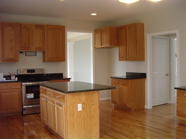 367 Raymond Road Plymouth, MA 02360 - Photo 5 of 12 a kitchen with granite countertop a sink and a stove top oven
