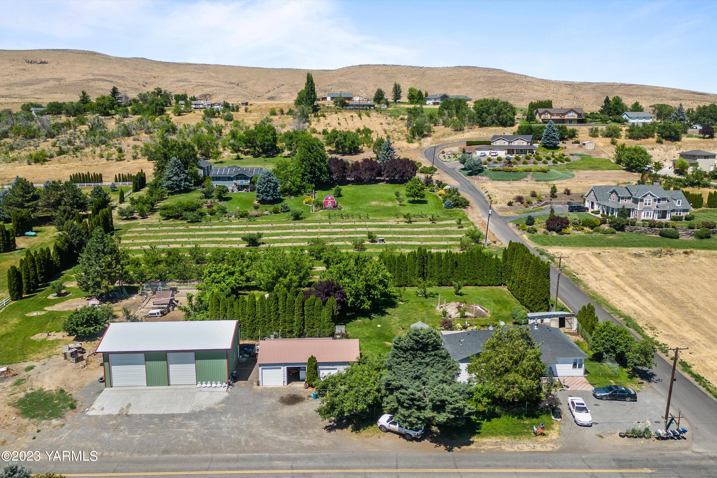 14901 Summitview Ext Road Yakima, WA 98908 - Photo 1 of 24 an aerial view of residential houses with outdoor space and trees