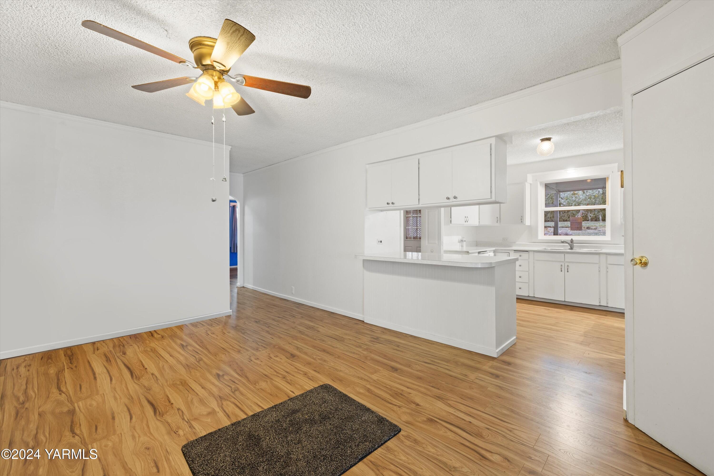 14901 Summitview Ext Road Yakima, WA 98908 - Photo 2 of 24 a kitchen with stainless steel appliances granite countertop a sink cabinets and wooden floor