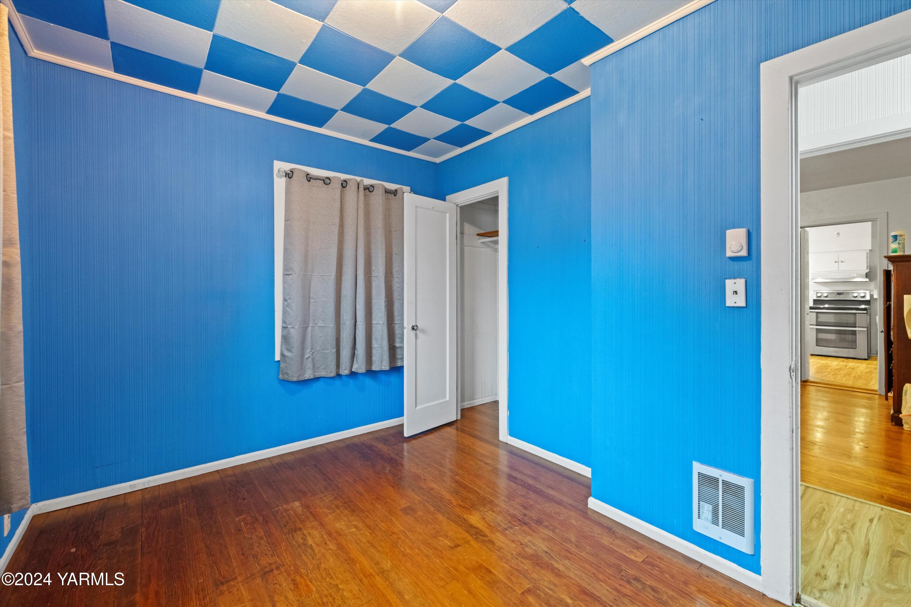 14901 Summitview Ext Road Yakima, WA 98908 - Photo 9 of 24 a view of empty room with window and wooden floor
