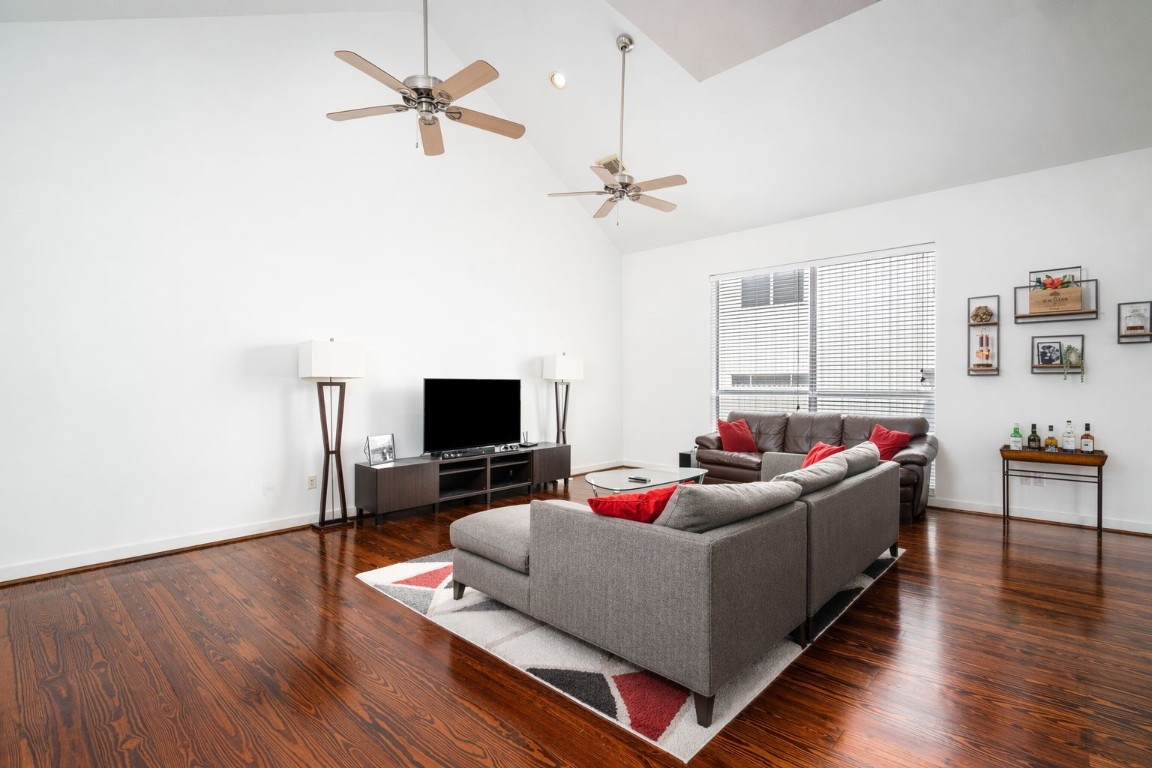 906 Andrews Street Houston, TX 77019 - Photo 11 of 23 a living room with furniture and a flat screen tv