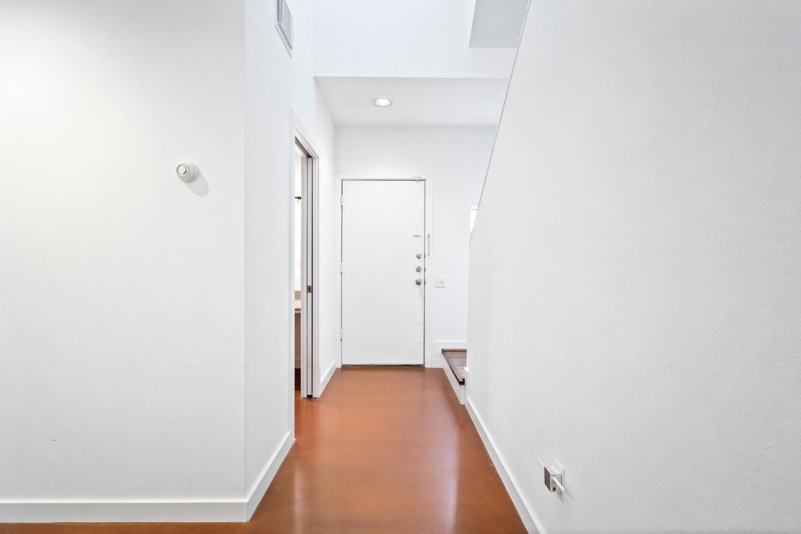 906 Andrews Street Houston, TX 77019 - Photo 4 of 23 a view of a hallway with wooden floor