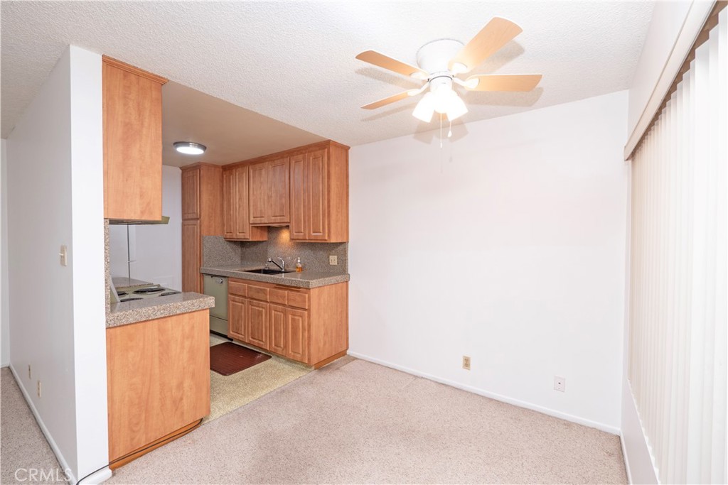 545 Chestnut Avenue, Unit 104 Long Beach, CA 90802 - Photo 20 of 48 a kitchen with cabinets a sink and dishwasher