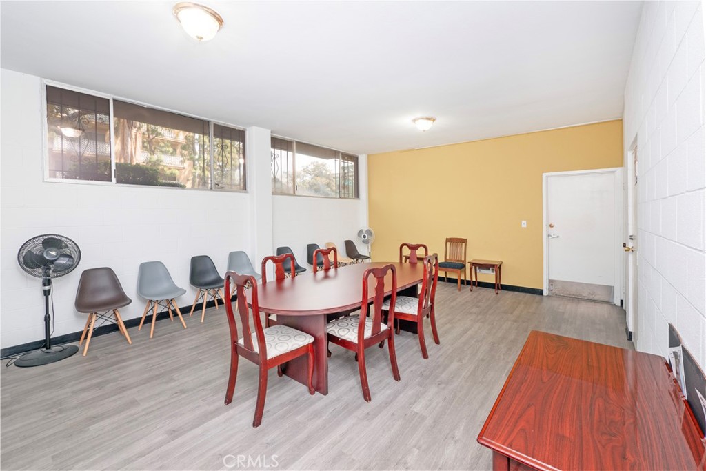 545 Chestnut Avenue, Unit 104 Long Beach, CA 90802 - Photo 42 of 48 a dining room with furniture window and wooden floor