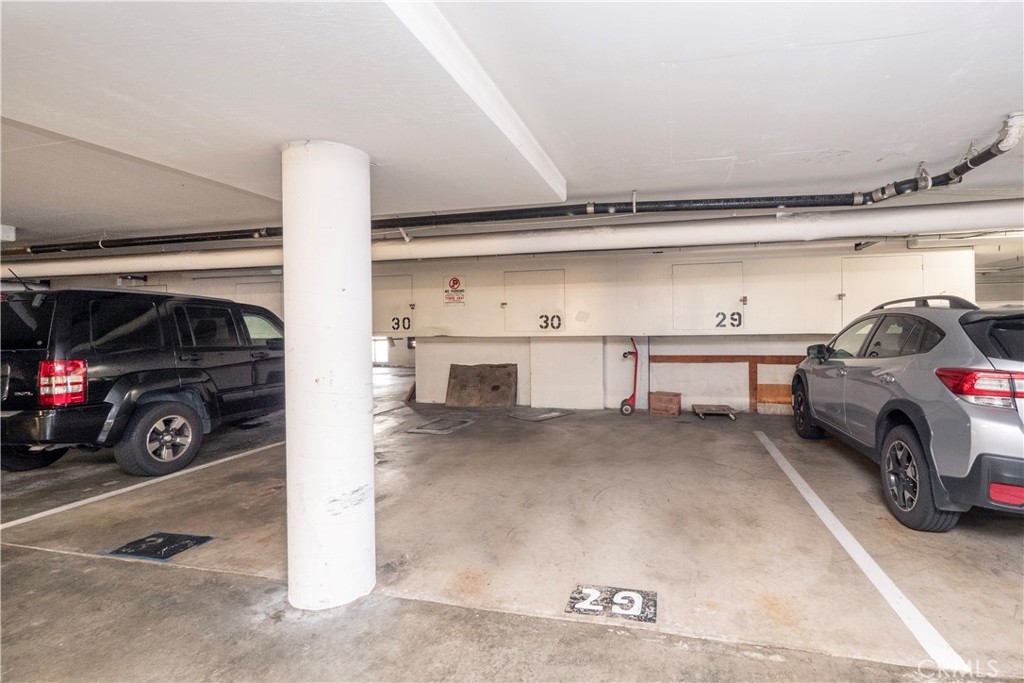 545 Chestnut Avenue, Unit 104 Long Beach, CA 90802 - Photo 44 of 48 a view of parking garage with cars
