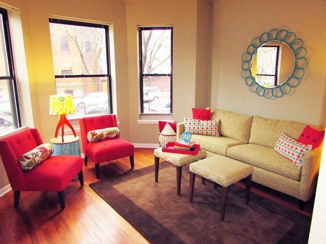902 West Grace Street, Unit 1 Chicago, IL 60613 - Photo 2 of 11 a living room with furniture a fireplace and a large window