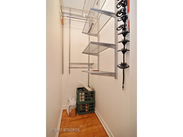 902 West Grace Street, Unit 1 Chicago, IL 60613 - Photo 10 of 11 a picture of a room with a door and wooden floor