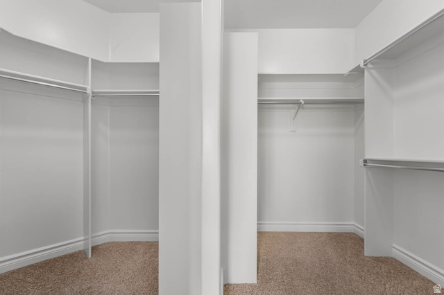 439 East 13540 South Draper, UT 84020 - Photo 18 of 46 Walk-in closet featuring extensive built-in shelving and hanging rods
