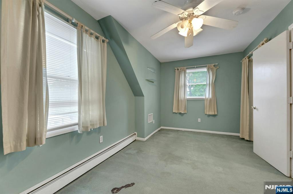 17 Butler Place Wanaque, NJ 07420 - Photo 28 of 28 a view of room with window and ceiling fan