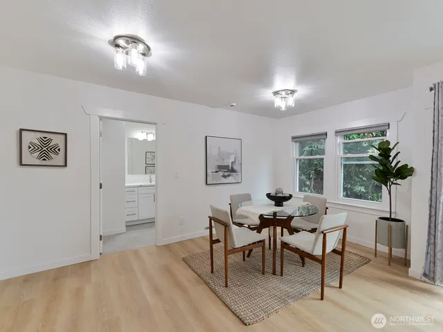 a view of a livingroom with furniture and a window