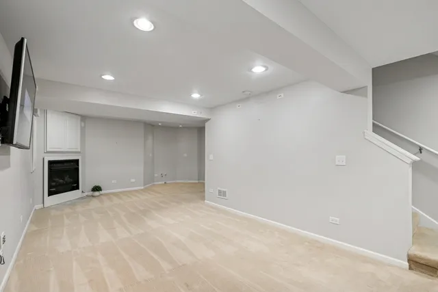 a view of empty room with fireplace