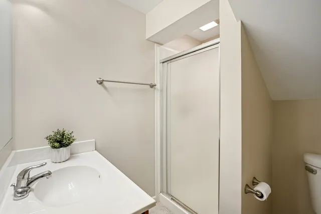 a bathroom with a sink and shower