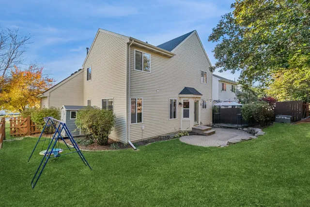 a front view of house with a garden and patio