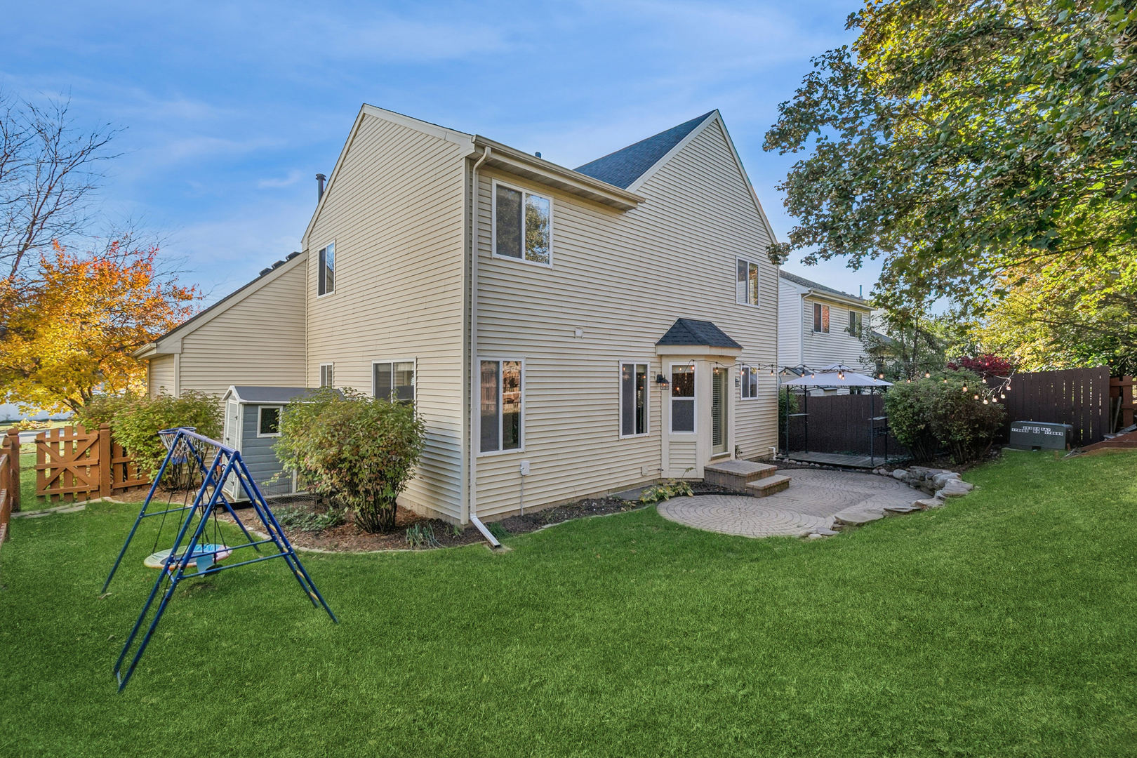 25904 Brooks Farm Road Round Lake, IL 60073 - Photo 19 of 20 a front view of house with a garden and patio