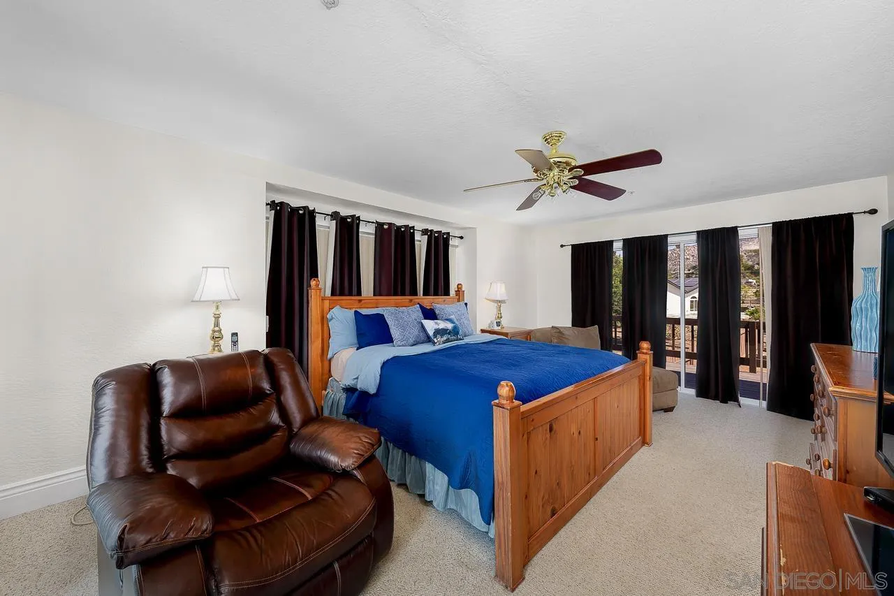 719 Singing Trails Drive El Cajon, CA 92019 - Photo 19 of 73 a bed room with furniture and a ceiling fan