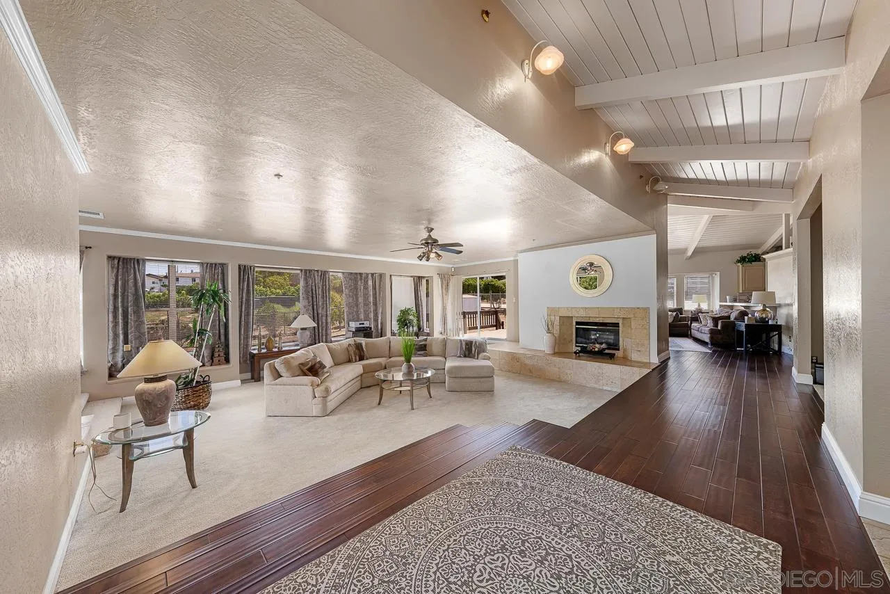 719 Singing Trails Drive El Cajon, CA 92019 - Photo 2 of 73 a living room with furniture large window and flat screen tv