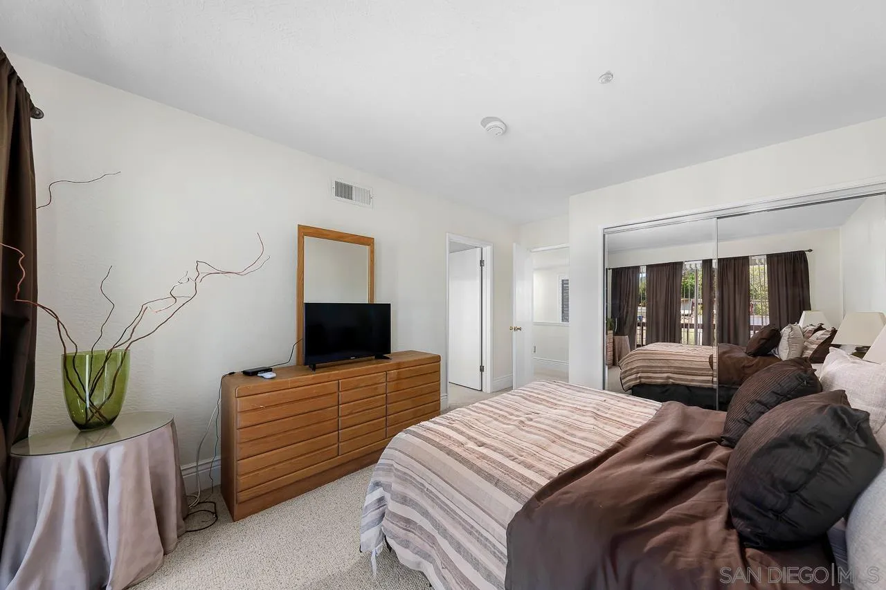 719 Singing Trails Drive El Cajon, CA 92019 - Photo 27 of 73 a bedroom with a bed and a television