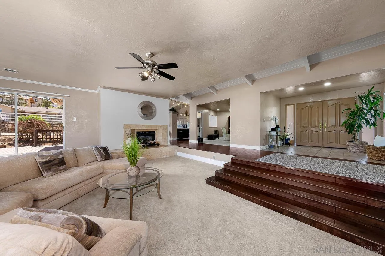 719 Singing Trails Drive El Cajon, CA 92019 - Photo 4 of 73 a living room with furniture and a fireplace