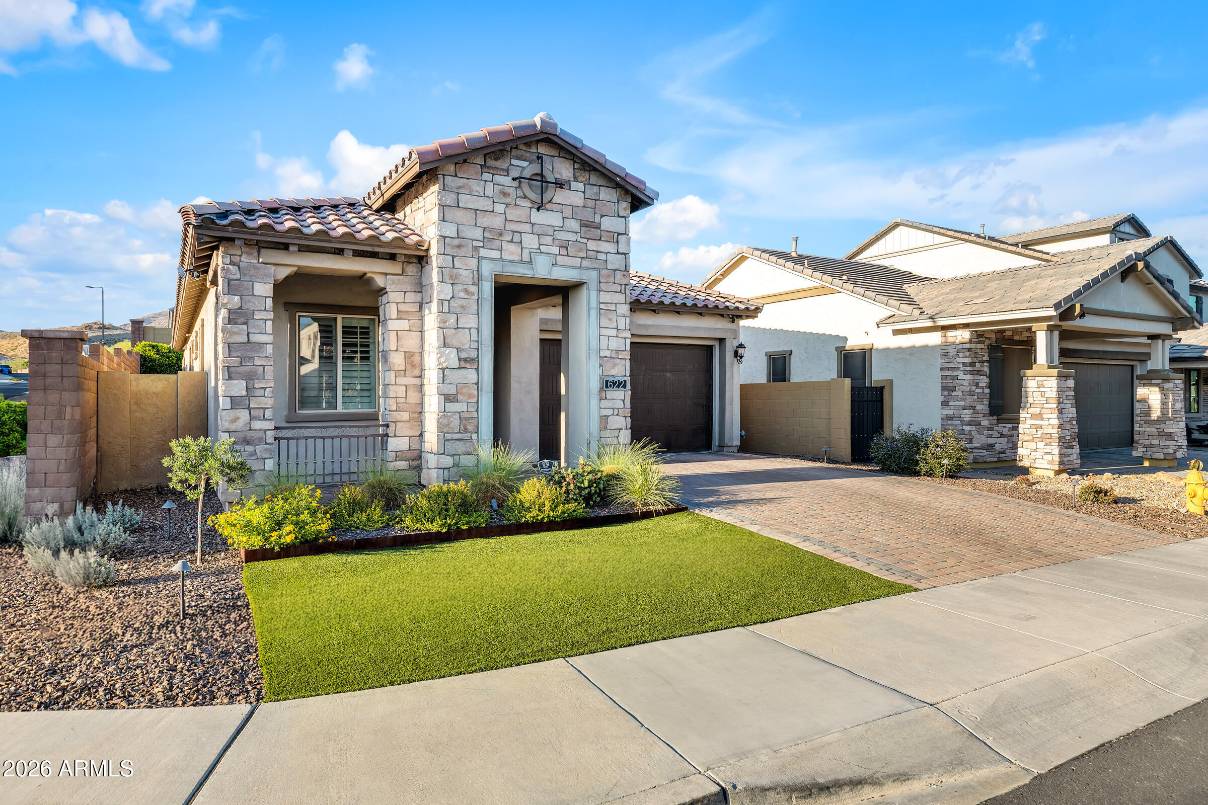 622 West Deer Creek Road Phoenix, AZ 85048 - Photo 1 of 39 a front view of a house with a garden