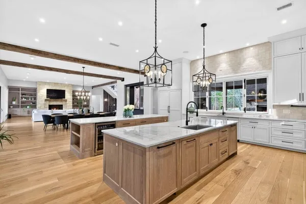 a kitchen with a refrigerator and cabinets