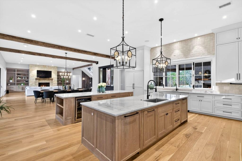 1050 Hamilton Road Northwest Kennesaw, GA 30152 - Photo 20 of 72 a kitchen with stainless steel appliances granite countertop a sink a oven a counter top space and living room view
