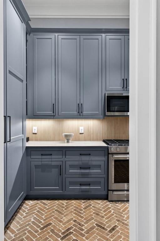 1050 Hamilton Road Northwest Kennesaw, GA 30152 - Photo 27 of 72 a kitchen with stainless steel appliances granite countertop a stove and a refrigerator with cabinets
