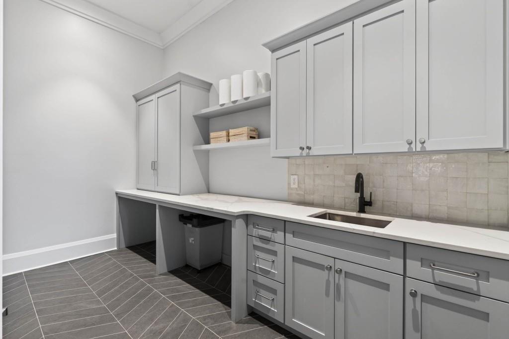 1050 Hamilton Road Northwest Kennesaw, GA 30152 - Photo 33 of 72 a view of cabinets a sink and dishwasher in a white cabinet