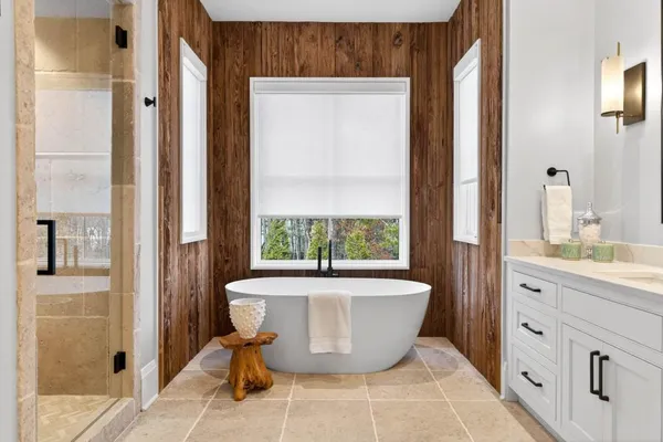 a spacious bathroom with a double vanity sink and a mirror