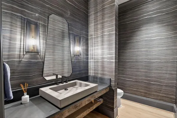 a bathroom with a shower sink and mirror