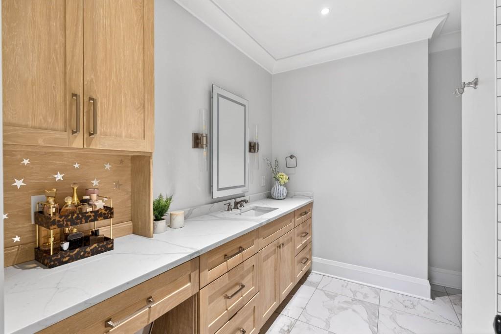 1050 Hamilton Road Northwest Kennesaw, GA 30152 - Photo 56 of 72 a spacious bathroom with a double vanity sink and a mirror