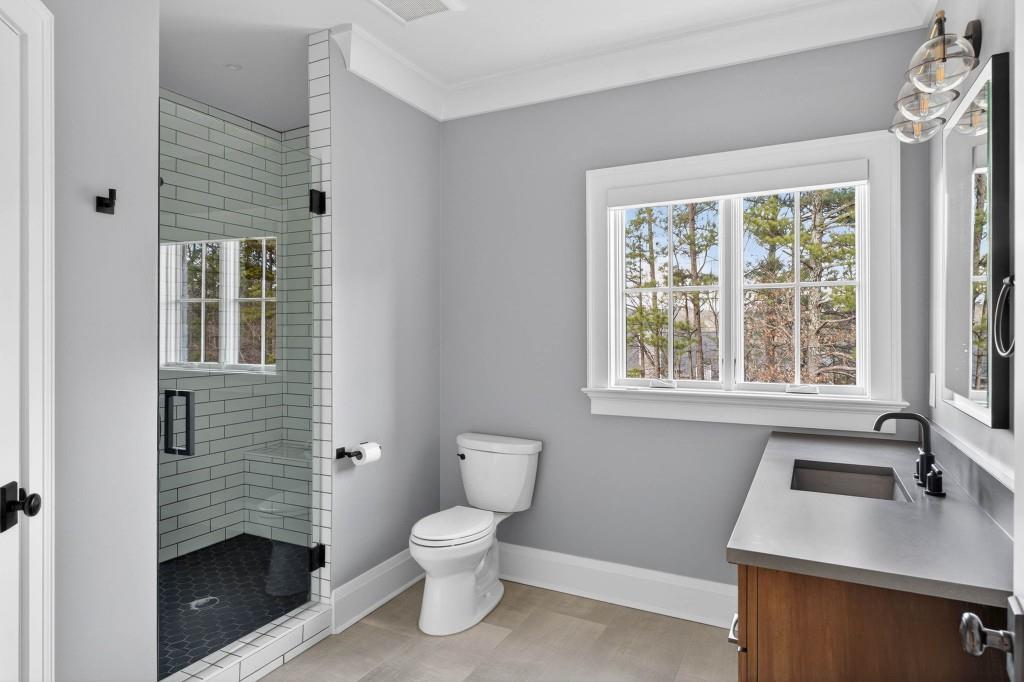 1050 Hamilton Road Northwest Kennesaw, GA 30152 - Photo 60 of 72 a bathroom with a sink a toilet and a window