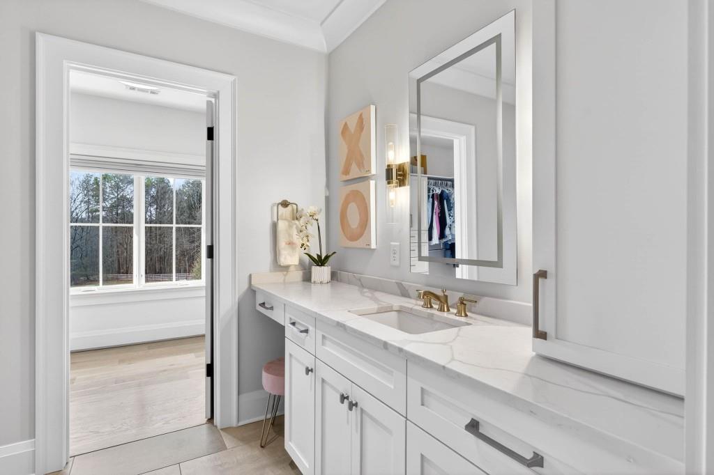 1050 Hamilton Road Northwest Kennesaw, GA 30152 - Photo 65 of 72 a bathroom with a sink double vanity and a mirror