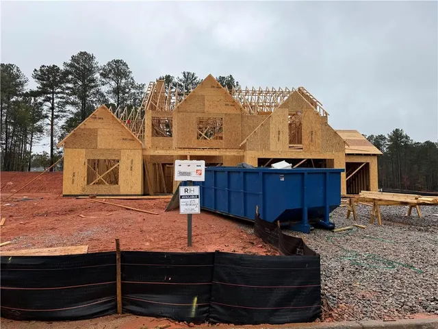 a bed room with a bed and a television