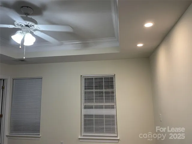 a view of a windows and a chandelier in a room