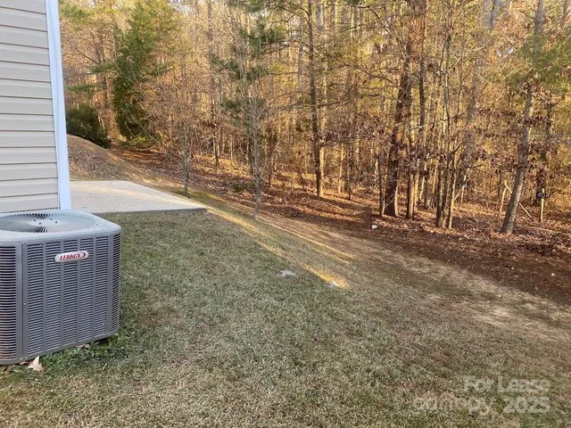 a view of pathway with yard