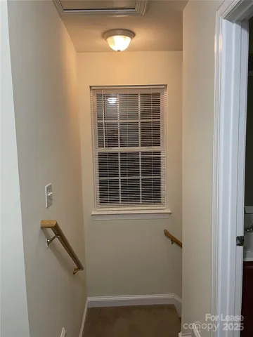 a view of empty room with windows