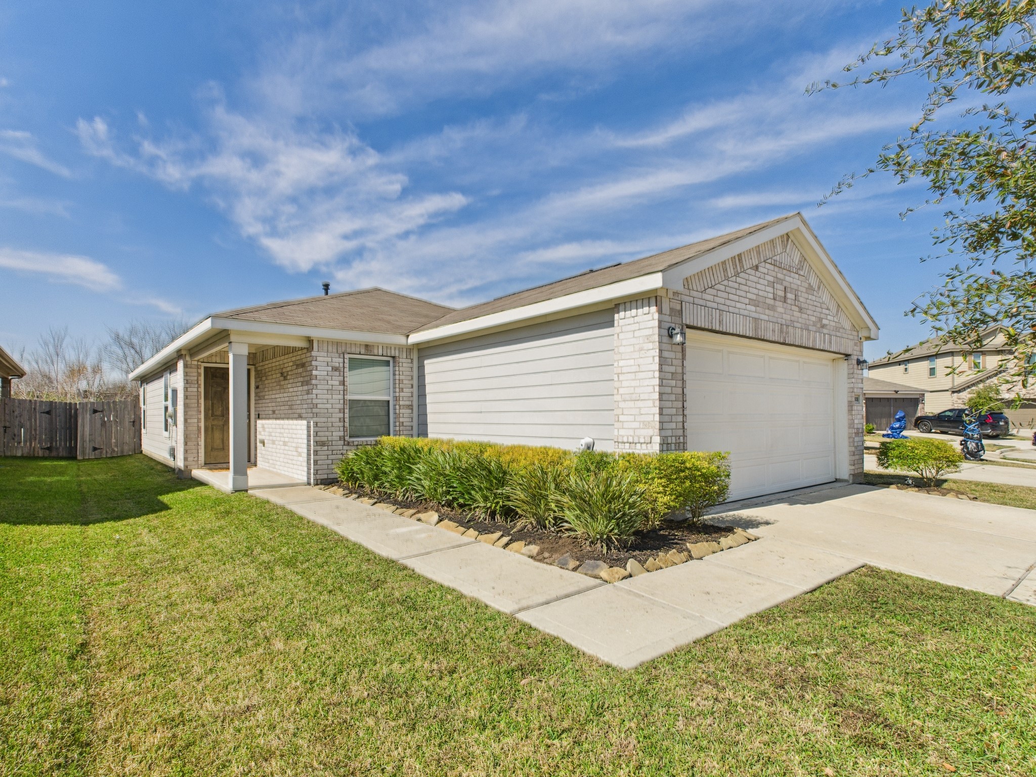 a front view of a house with garden