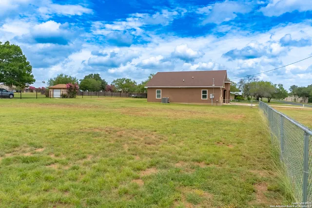 a view of a lake with a big yard