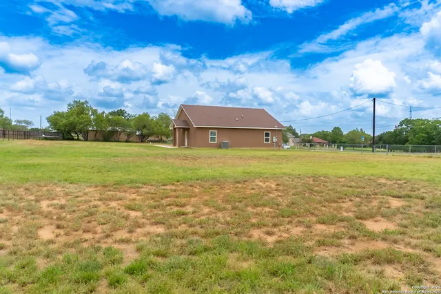 a view of a building with a big yard