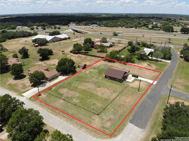 a view of a kitchen cabinets and wooden floor