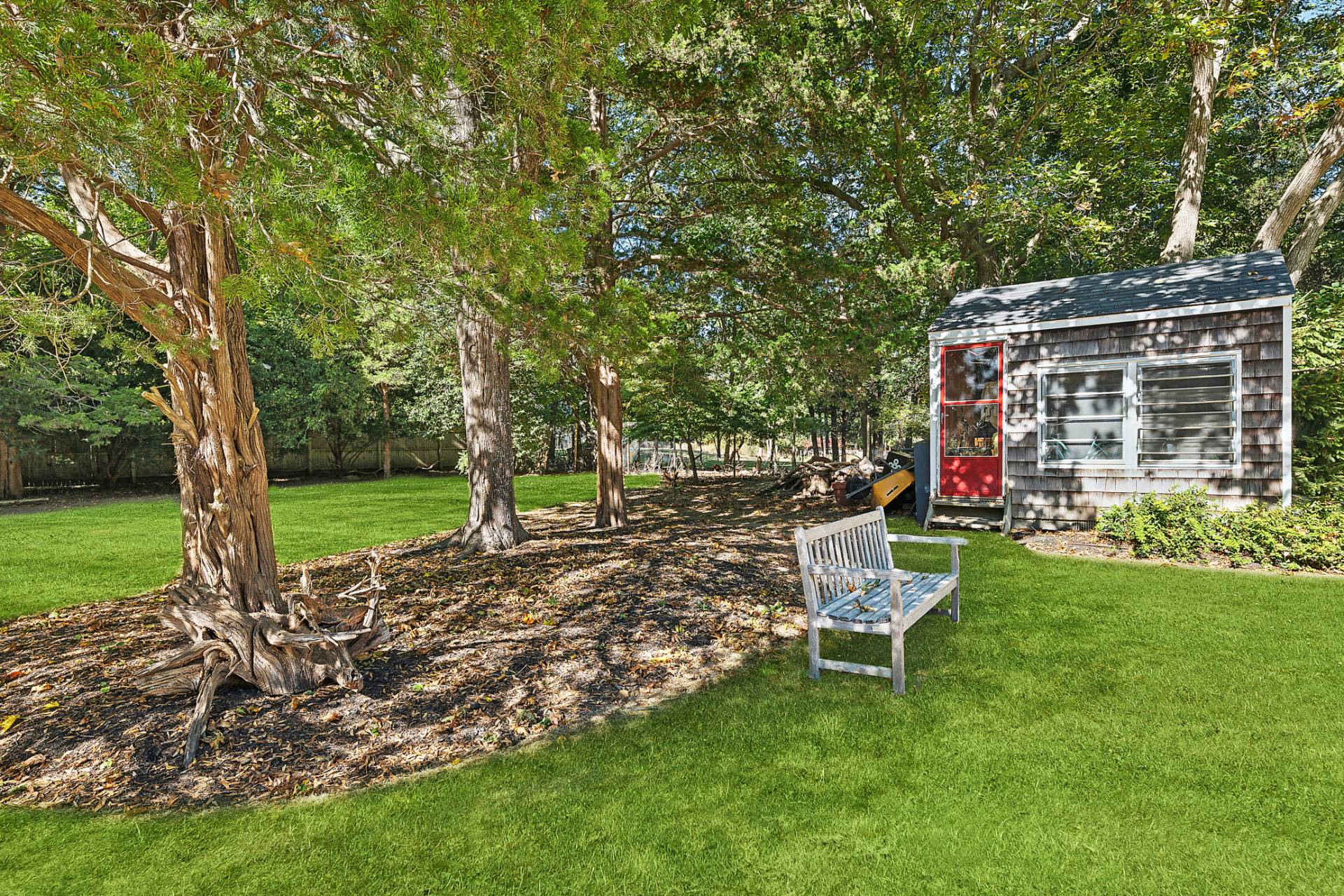 1214 Fireplace Road East Hampton, NY 11937 - Photo 17 of 19 a view of a house with backyard porch and sitting area