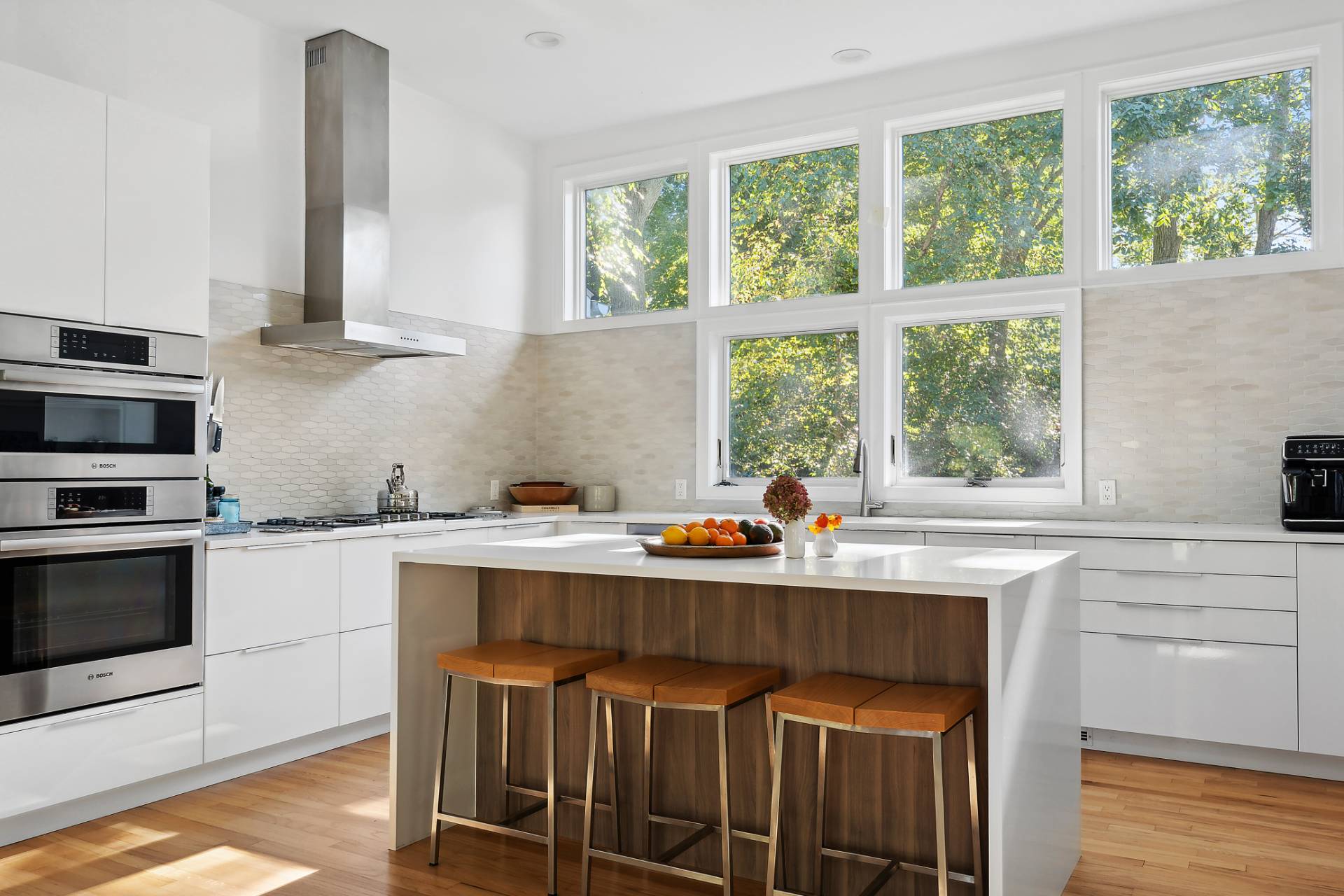 1214 Fireplace Road East Hampton, NY 11937 - Photo 2 of 19 a kitchen with a stove a sink and windows