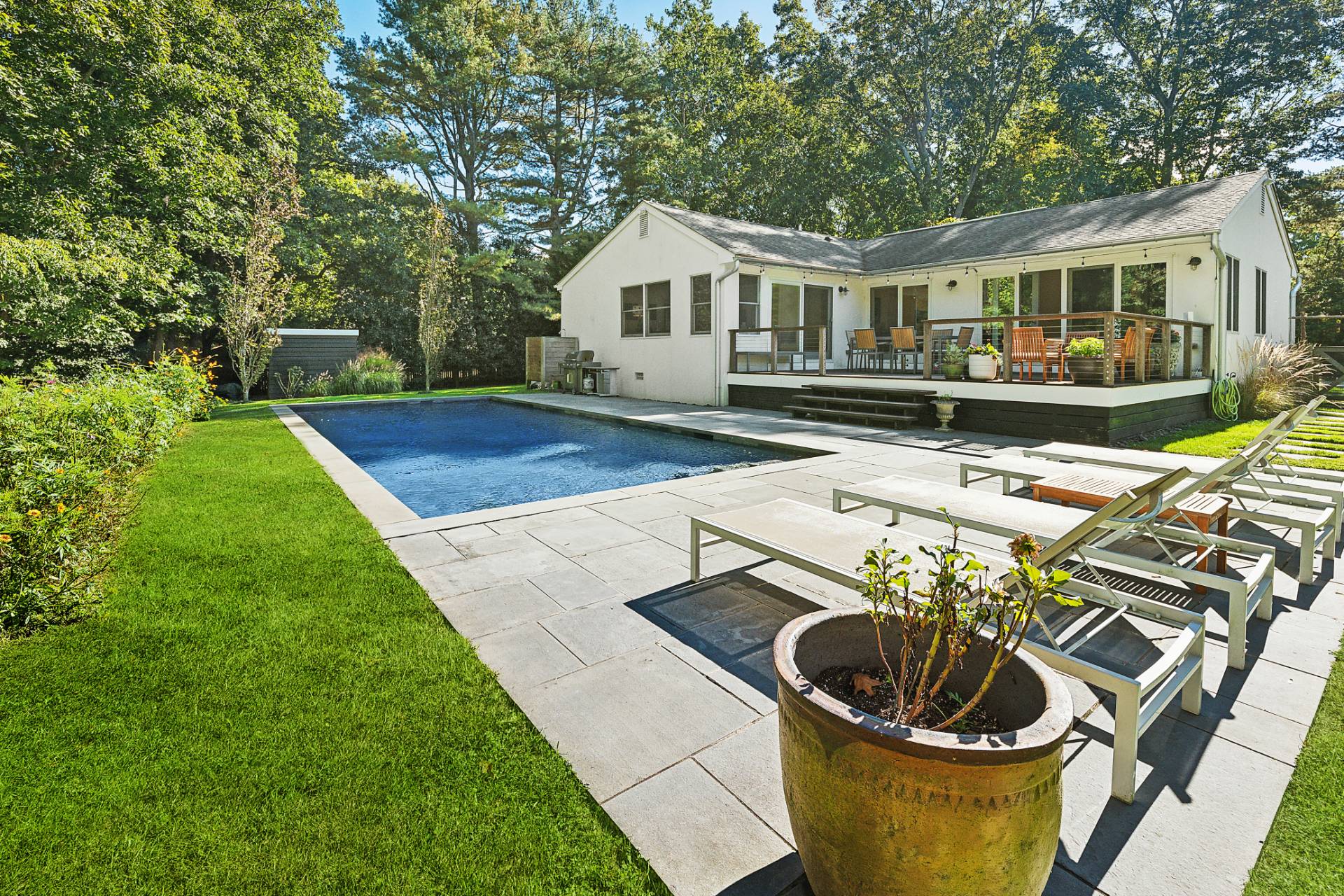1214 Fireplace Road East Hampton, NY 11937 - Photo 3 of 19 a house view with a seating space and a garden