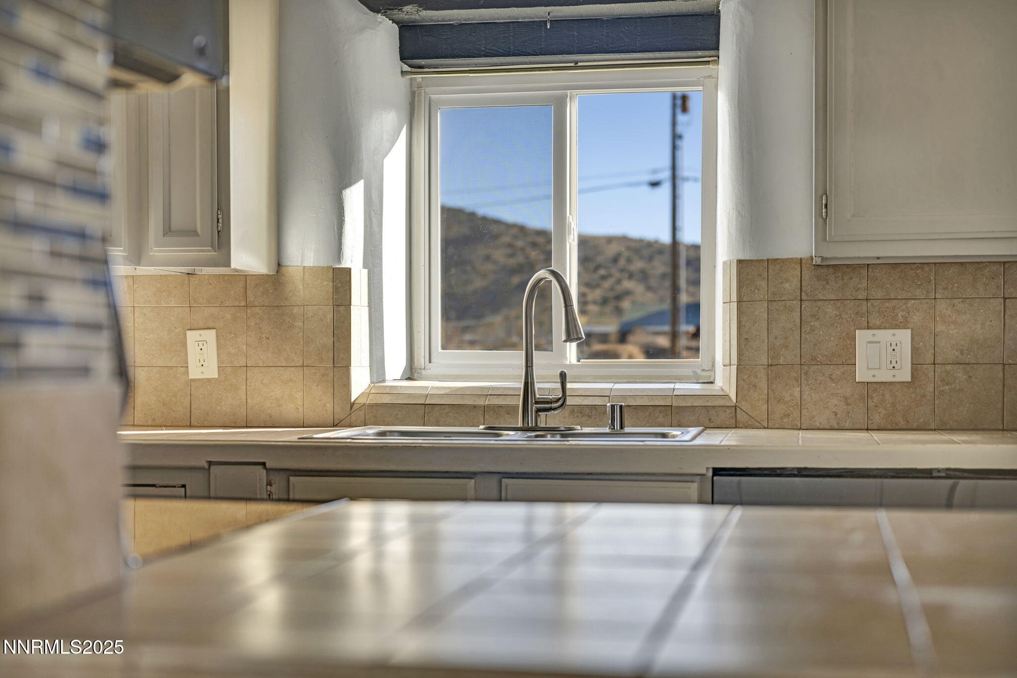 10810 Chesapeake Drive Reno, NV 89506 - Photo 17 of 34 a view of a bathroom with a sink and a mirror