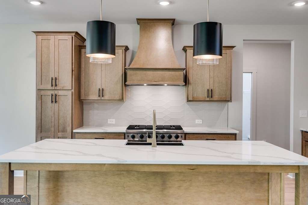 1593 Bethesda Church Road Carrollton, GA 30117 - Photo 17 of 48 a kitchen with a refrigerator a stove and a wooden floor